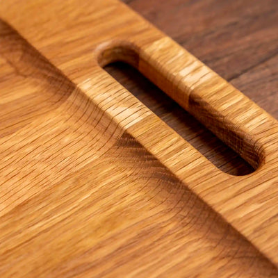 White Oak Barbecue Board. Close up of handle and raised edge.