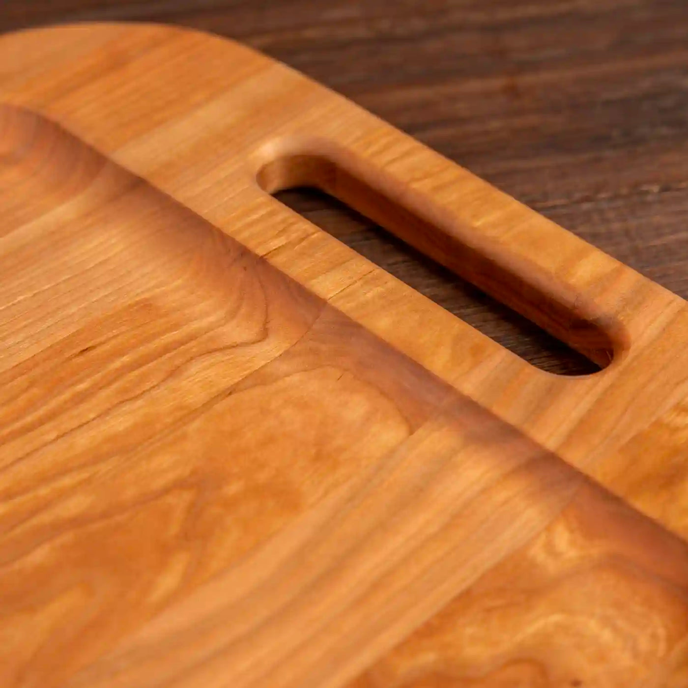 Cherry Barbecue Board with handles. Close up of handle.