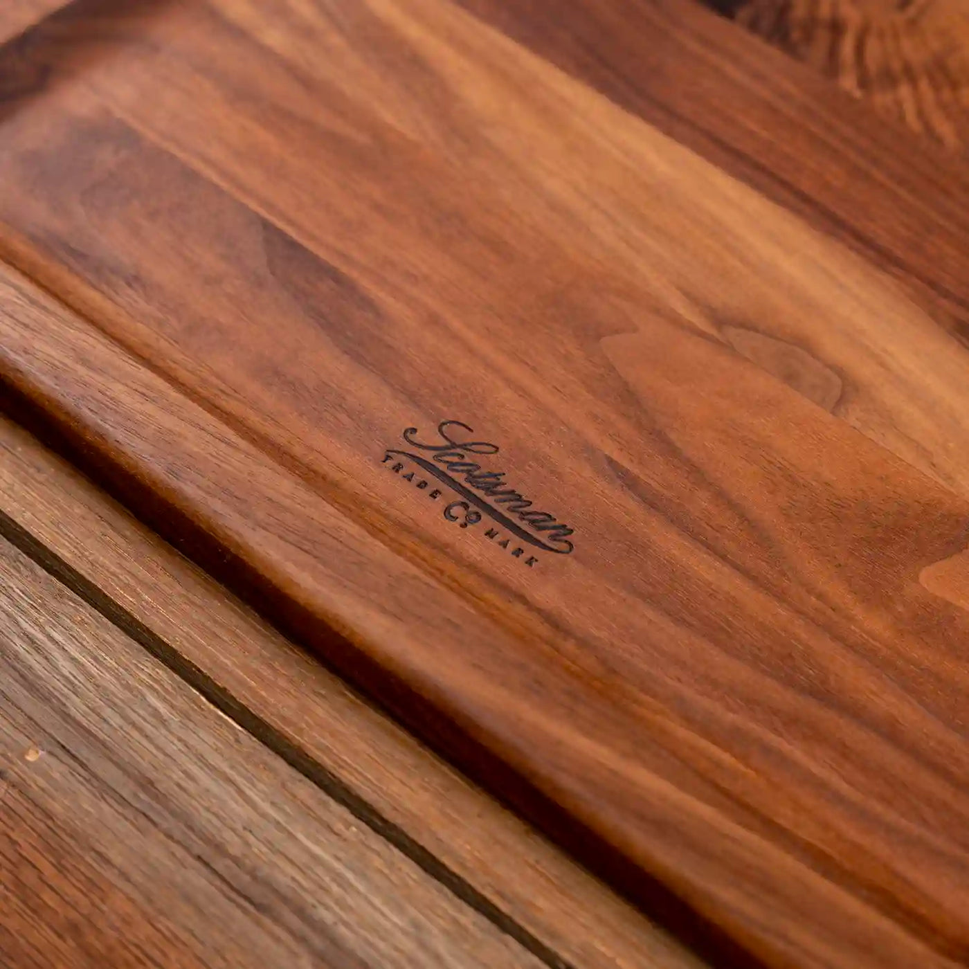 Walnut Barbecue Board with handles. Close up of Scotsman logo.