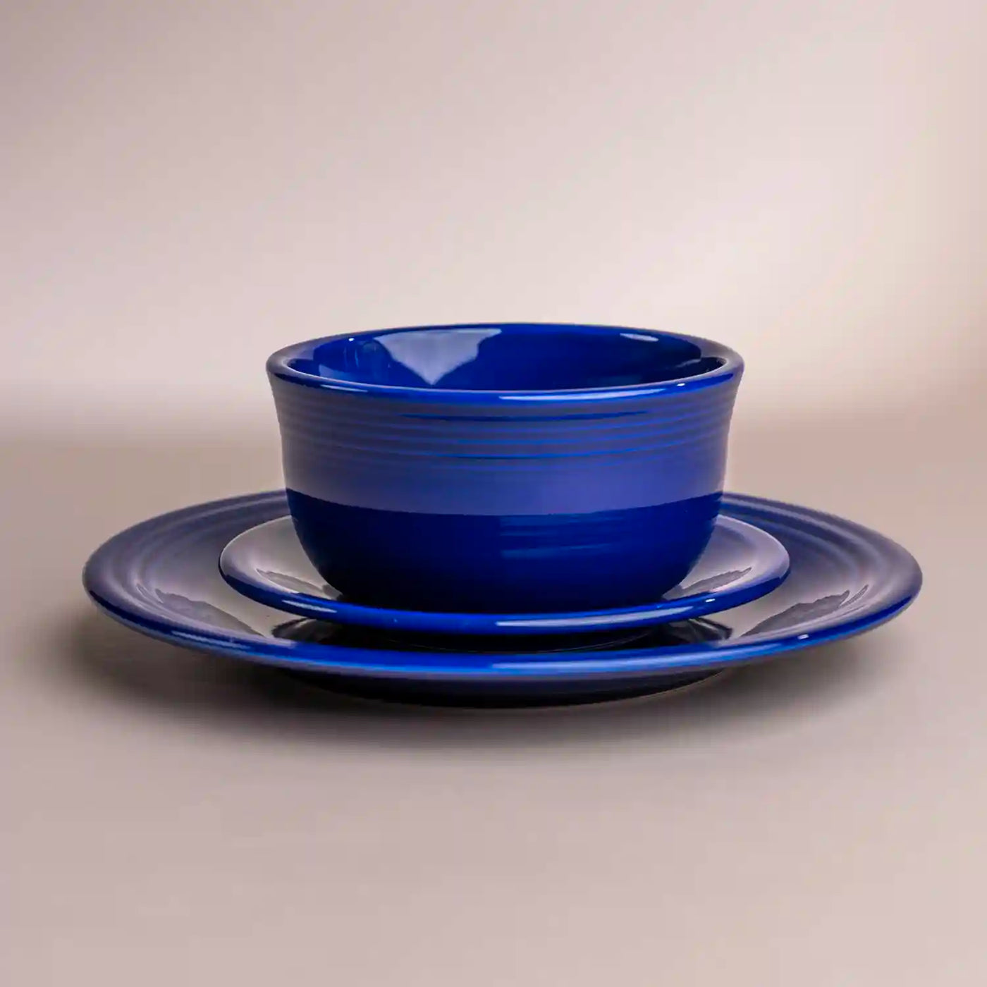 Fiesta twilight blue dinner plate salad plate and gusto bowl. Stacked. 