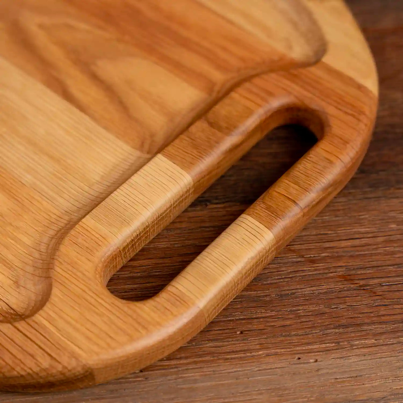 White Oak Oval Barbecue Board. Close up of handle. 