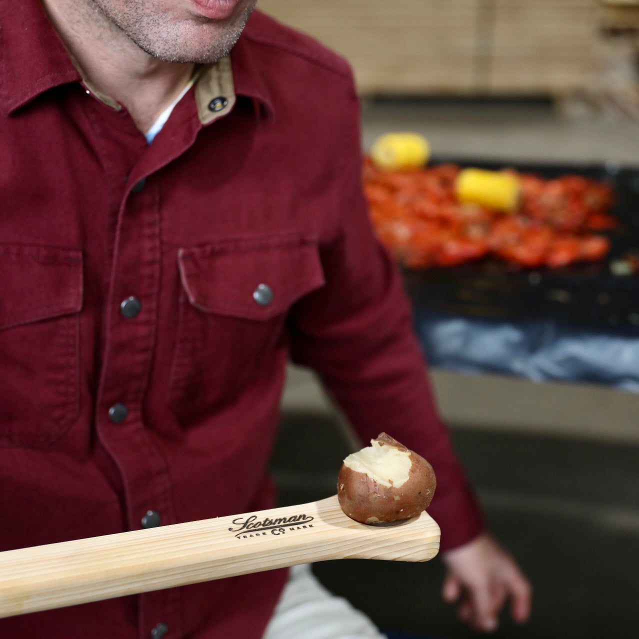 Cypress crawfish paddle with potato on tasting handle.